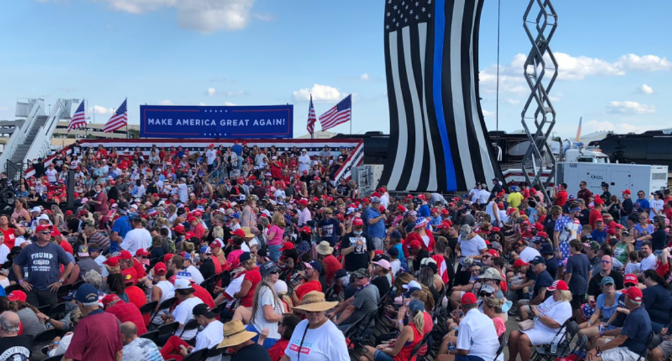 WATCH: Unmasked Trump supporters risk super-spreader event at Florida airport