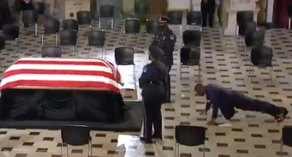 WATCH: Ruth Bader Ginsburg's trainer performs pushups in front of her coffin