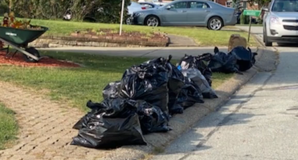 QAnon letter carrier raided by federal agents — who found undelivered mail in trash bags: report