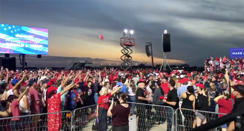 Trump staff ensure there are plenty of MAGA hats — at maskless Florida rally during pandemic