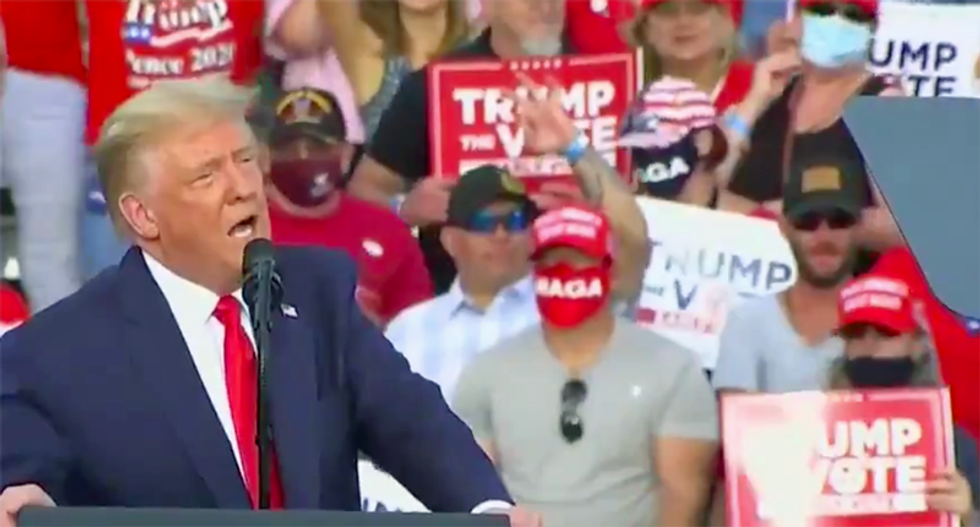Did a maskless Trump supporter flash a ‘white power’ sign at his The Villages rally?