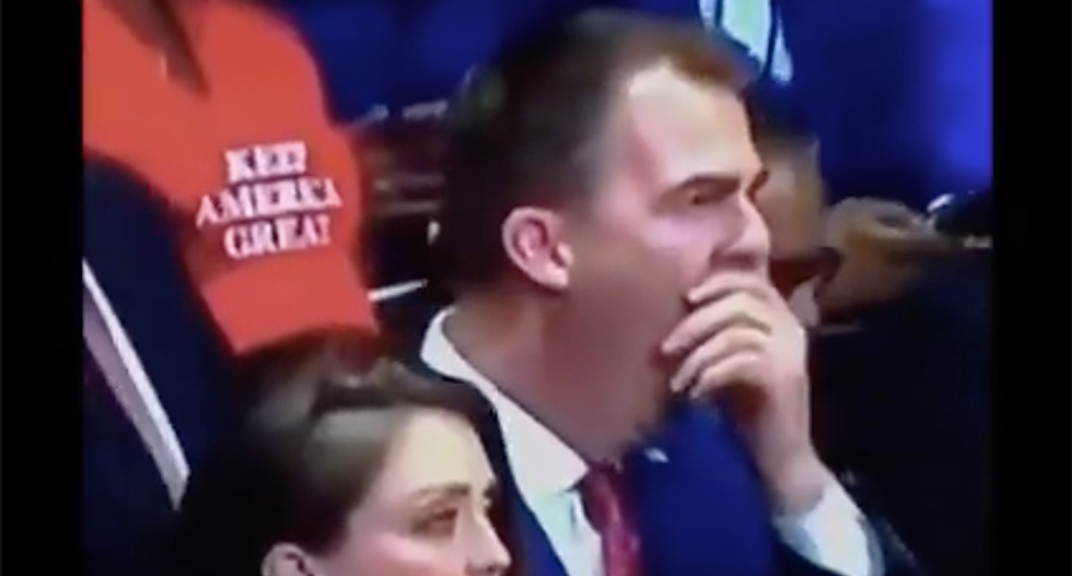 Oklahoma's Republican governor busted on camera yawning at Trump's rambling speech