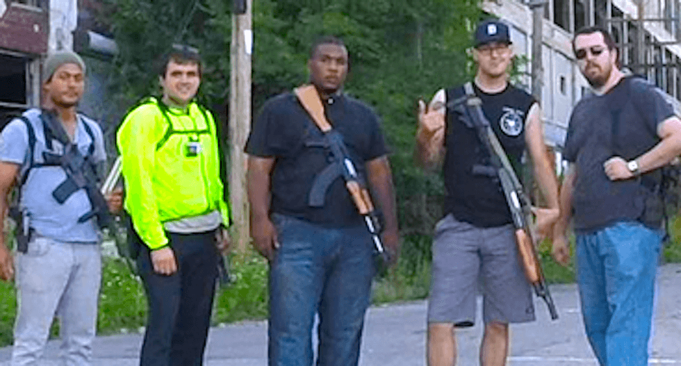 Gun lovers parade with firearms to protest arrest of black open-carry activist