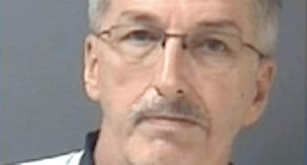 Michigan man grills kids at gunpoint over damaged Trump sign — until cops show up and arrest him