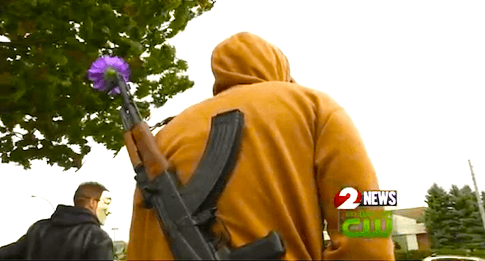 Protesters carry firearms into Walmart where cop gunned down black man over toy gun