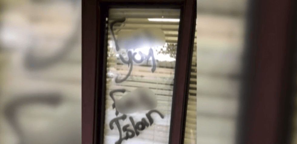 Mosque pays off debts of man who spray painted hateful messages on their building in 2016