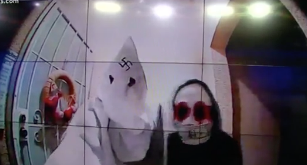 Shocking door cam video shows man in KKK hood with swastika on it