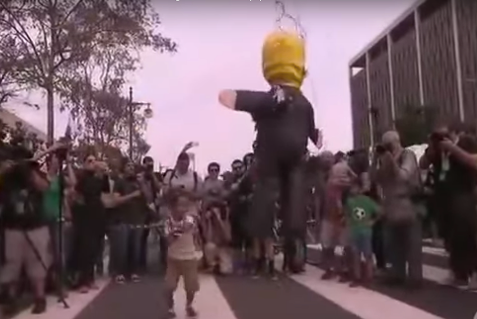 WATCH: Kids at protest whack Donald Trump piñata