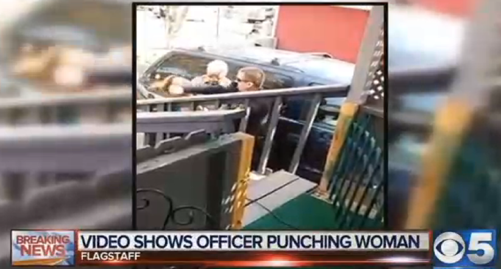 Arizona officer who punched woman is put on leave as probes begin