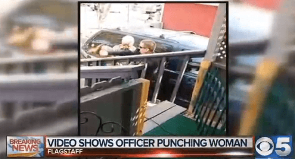 Arizona officer who punched woman is put on leave as probes begin