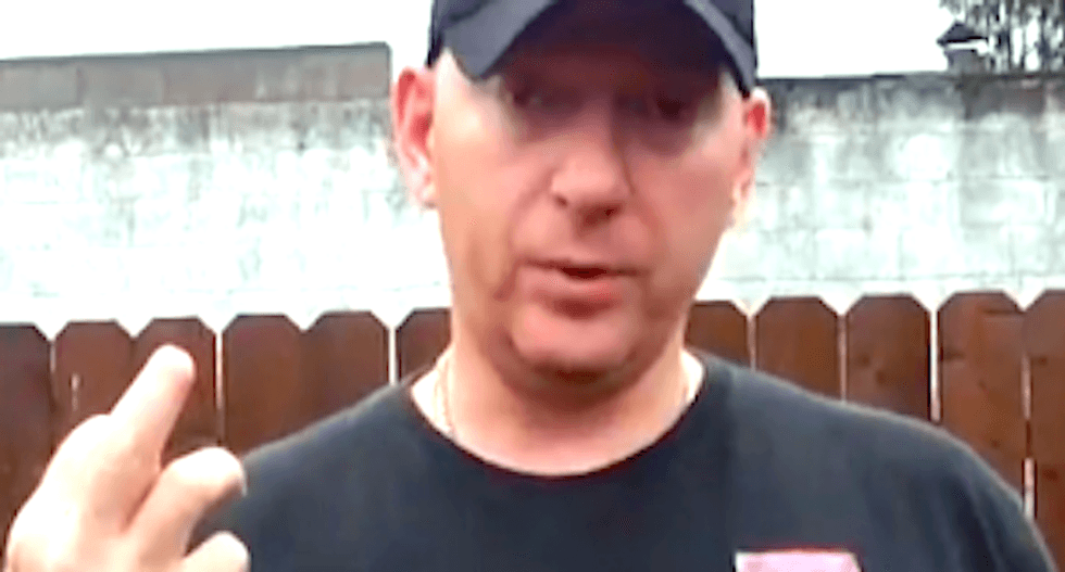 ‘Libtard’-hating ex-police chief accused of pointing gun at woman who passed his Hummer