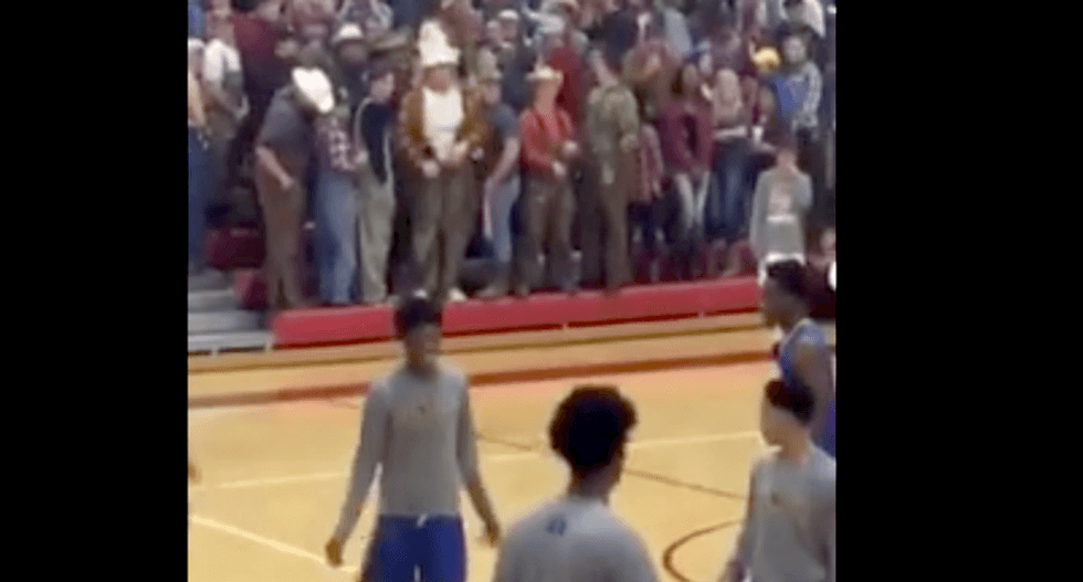 Missouri school apologizes after white students hold up Trump sign and turn backs on all-black basketball team