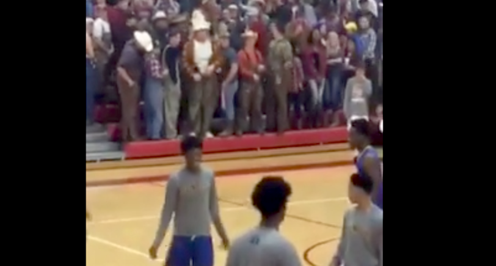 Missouri school apologizes after white students hold up Trump sign and turn backs on all-black basketball team