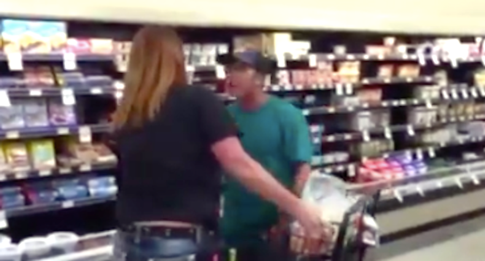 WATCH: Anti-masker shrieks in woman employee's face -- and meekly flees when male security guard backs her up