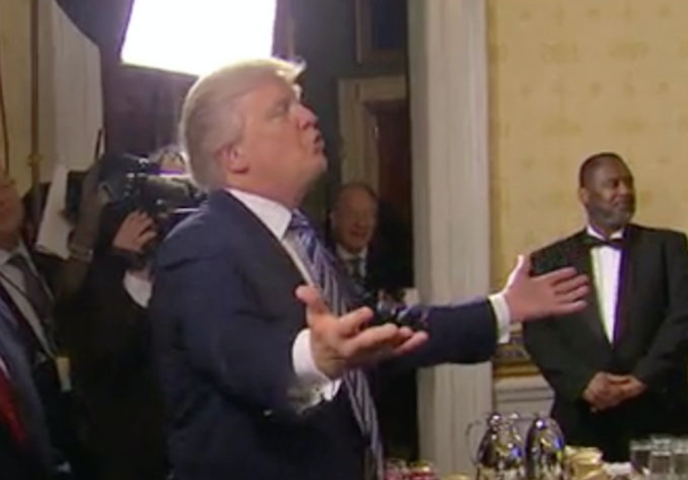 Pres. Trump nuzzles FBI Director James Comey’s cheek after blowing him a kiss at White House event