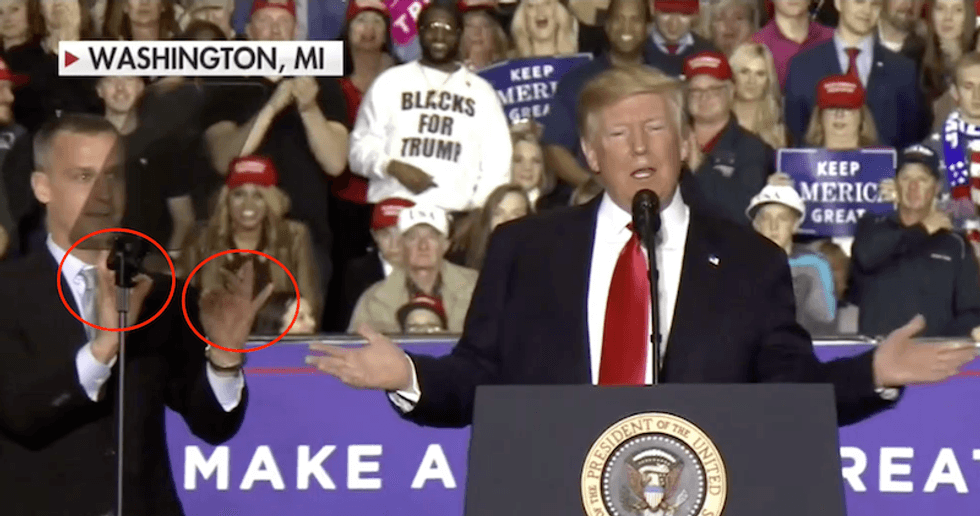 Corey Lewandowski flashes white power 'OK' symbol on stage at Trump's Michigan rally