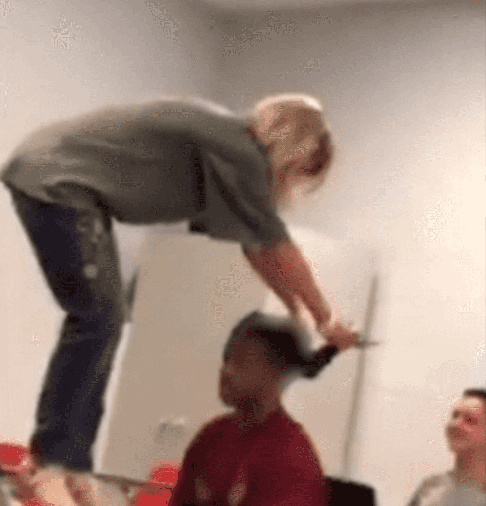 Teacher caught on video pulling black kids' dreadlocks swears it wasn't a 'malicious act'