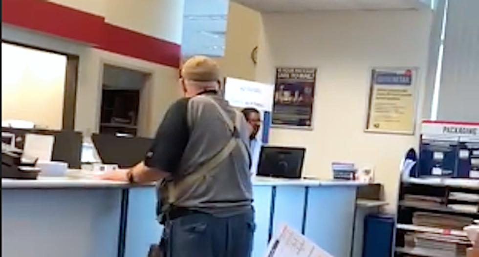 WATCH: Black postal worker stays remarkably calm as furious white man has a racist meltdown