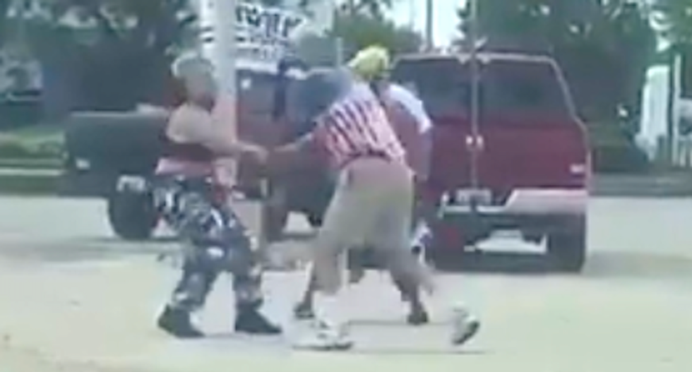 Trump supporter whacks Black teens with a flag pole in brawl caught on video