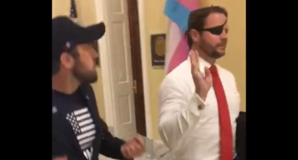 WATCH: GOP congressman hides in an elevator as veterans try to confront him about his support for Trump