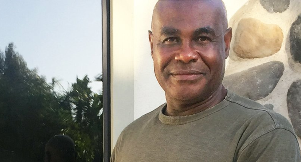 Black man walking his dog gets hunted as burglary suspect after white neighbor snaps picture of him and reports it as 'suspicious'