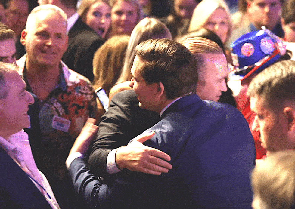 Images show FL Governor Ron DeSantis hugging Rudy Giuliani's henchmen after claiming he didn't know them