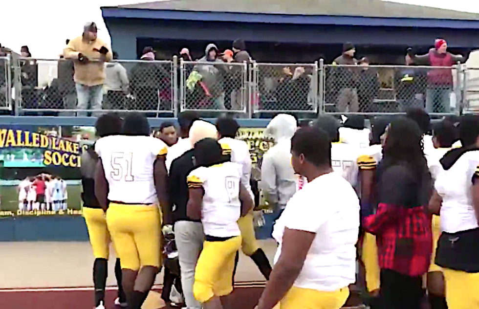 Black students spit upon and pelted with garbage by parents after taking a knee at high school football game