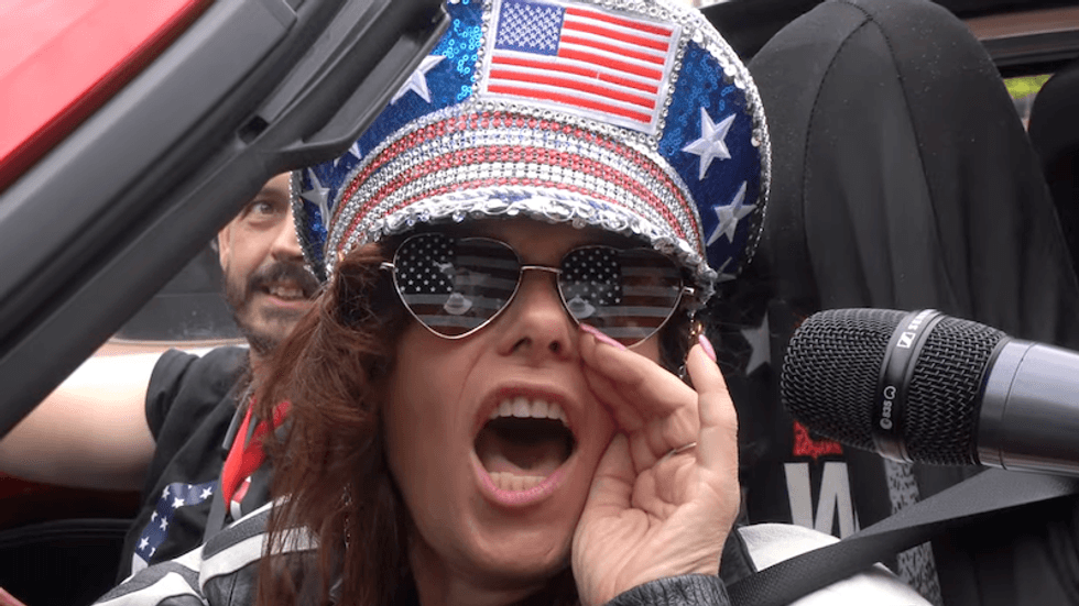 'We're in a war!' The bizarre beliefs of QAnon followers are detailed in this new video — which features Michael Flynn
