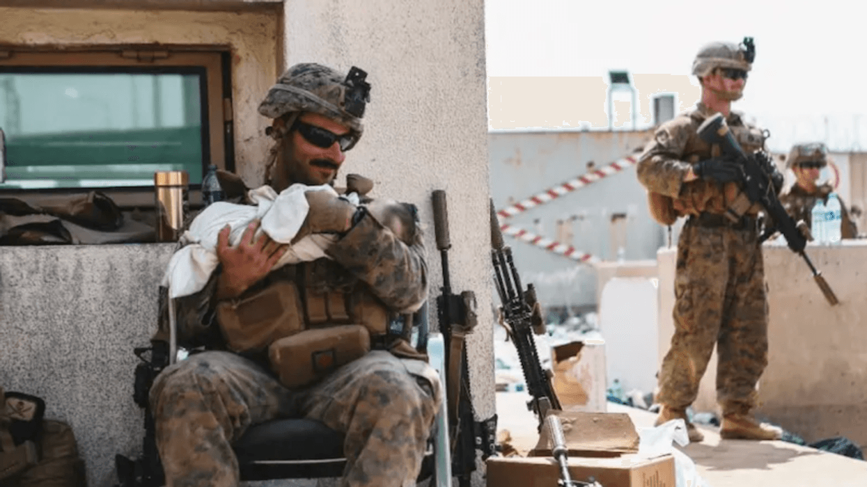 Viral footage of US Marine aiding baby captures Kabul chaos
