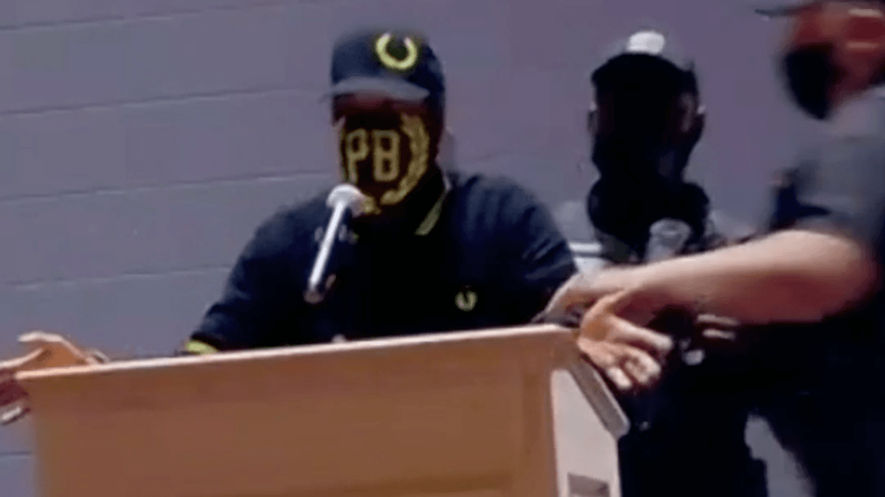 WATCH: Proud Boys escorted out of meeting as school board OKs resolution condemning racism