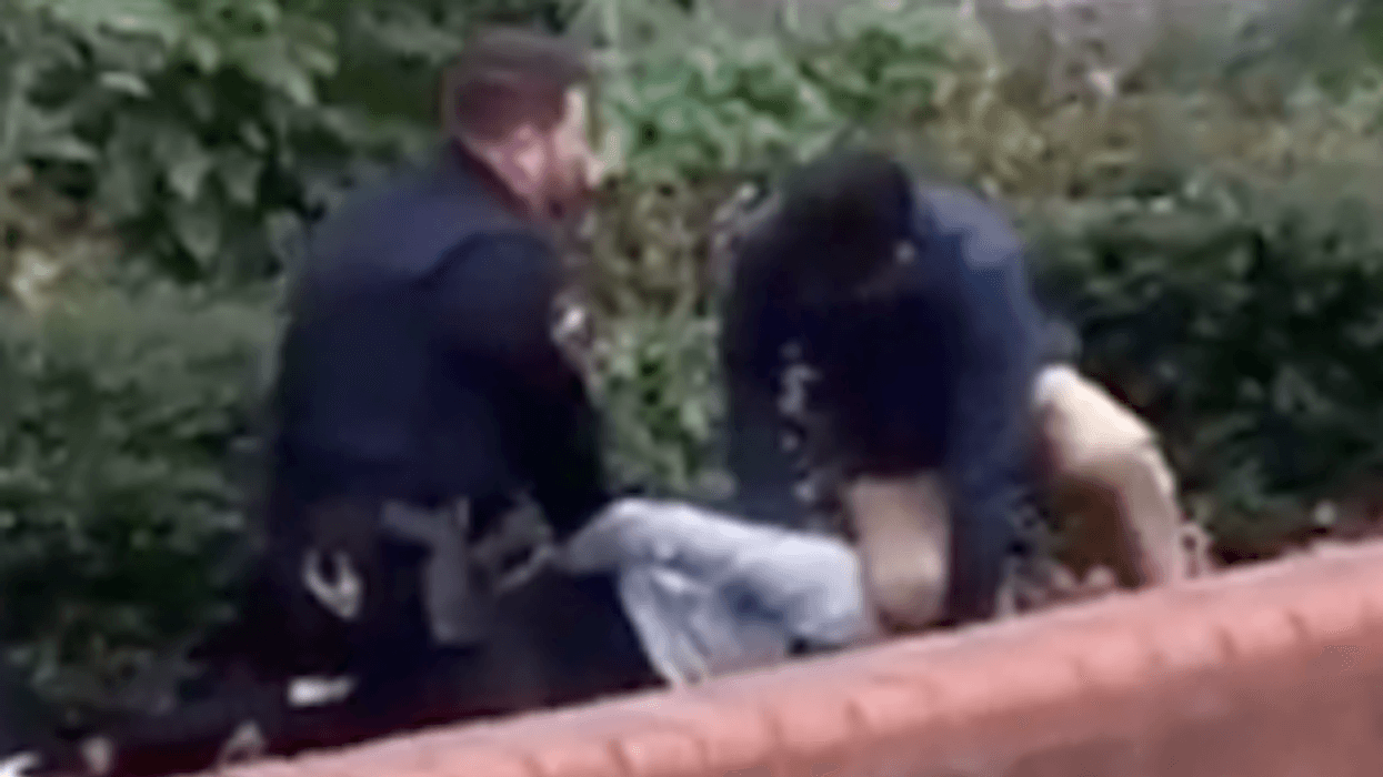 'How does this occur?' Video shows principal kneeling on student's neck as officer handcuffs him