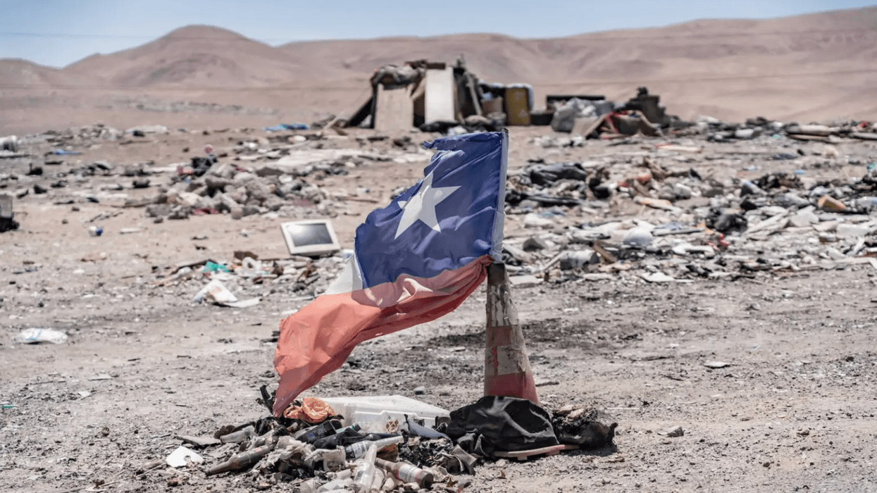 A mountain of used clothes appears in Chile's desert. Then it went up in flames.