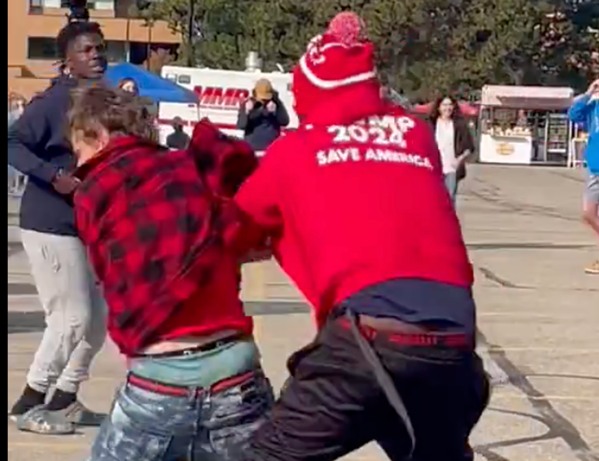 WATCH: Fight breaks out between vendors before Trump’s Michigan rally kicks off