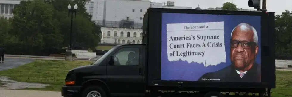 Watchdog sends mobile billboard to Roberts' country club demanding: 'Clean up court'