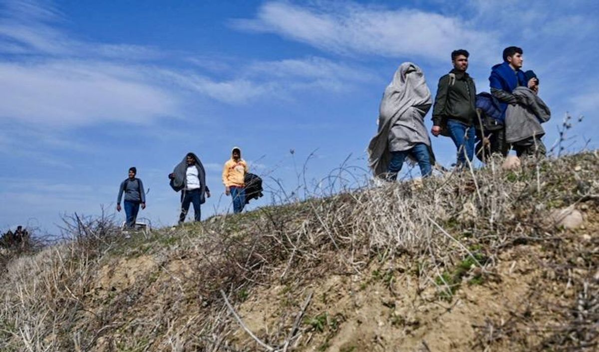 Greece and Turkey trade blame after dozens of nearly naked migrants found on border