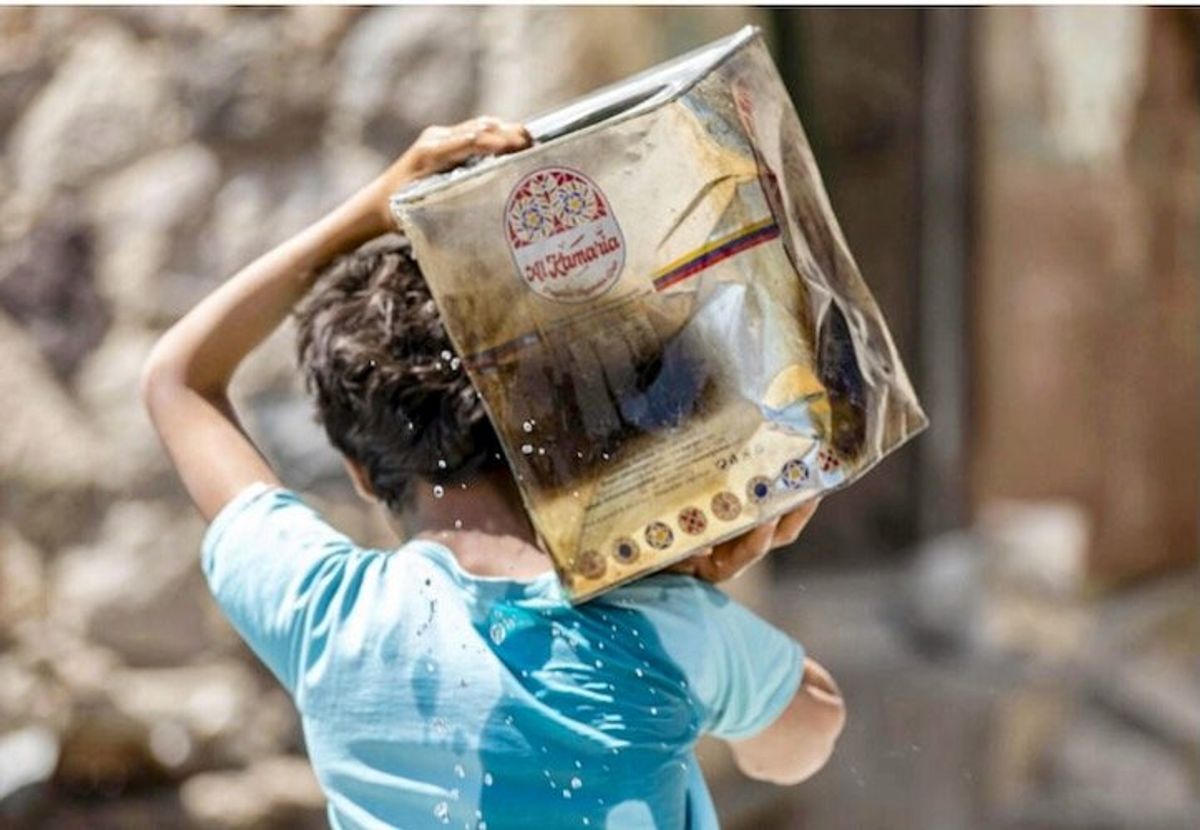 Children in war-scarred Yemen line up for water, not school