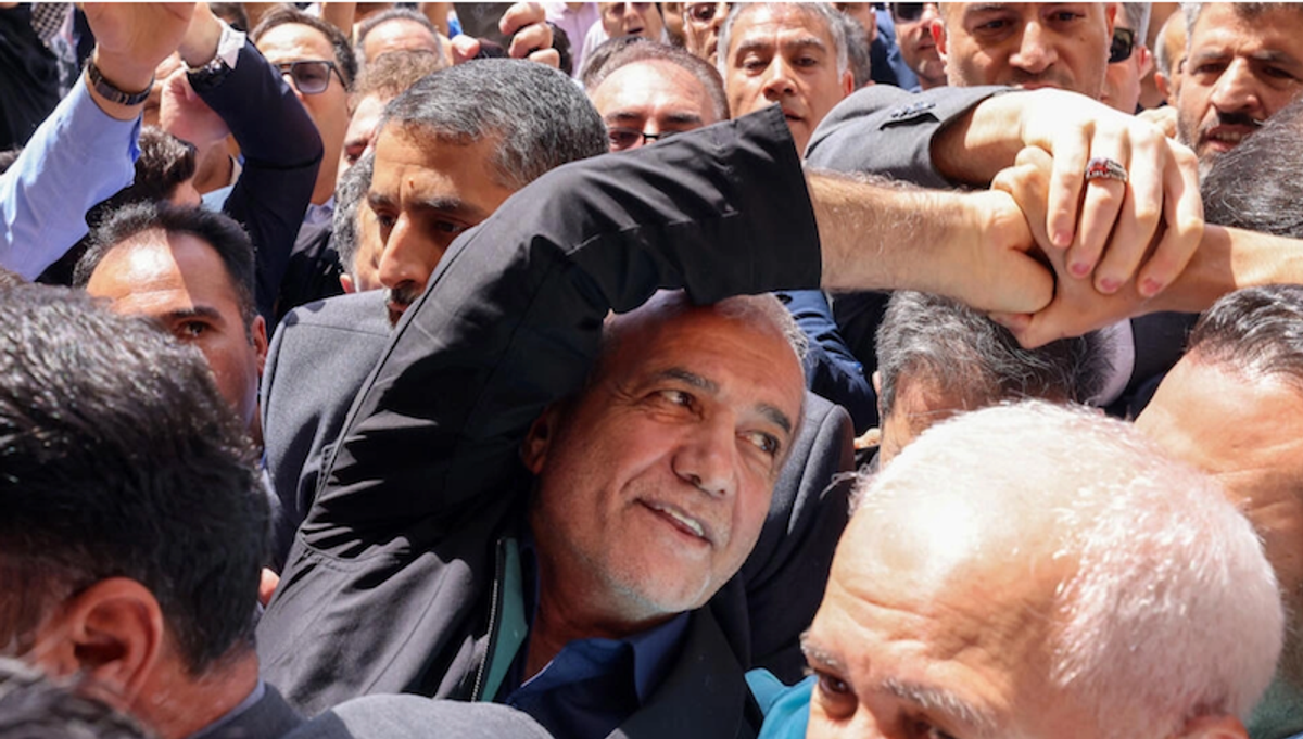 Calling for better ties with West, Iran reformist wins presidency