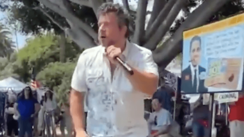 'Get your guns!' Furious anti-vaxxer bellows violent threats against door-to-door volunteers