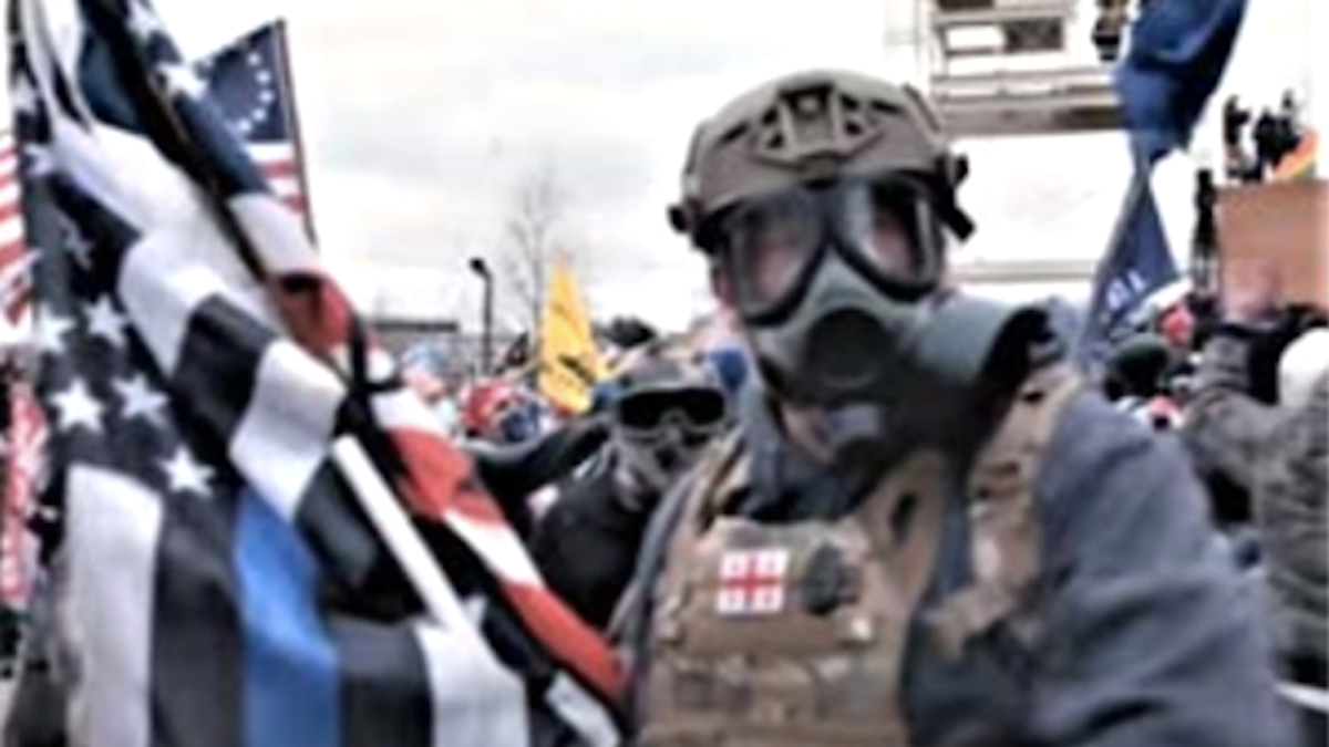 Military veteran charged with stabbing cop in the face after carrying Blue Lives Matter flag to Jan. 6 riot