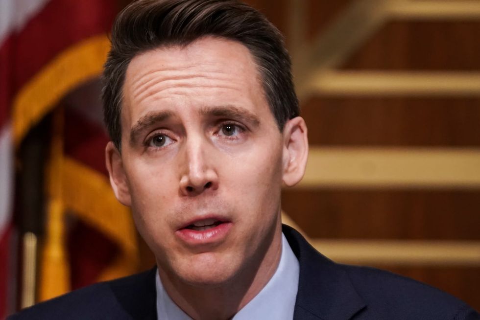 ‘Traitorous’ Josh Hawley blasted for sitting in Senate gallery ‘with his feet up’ and ignoring impeachment trial