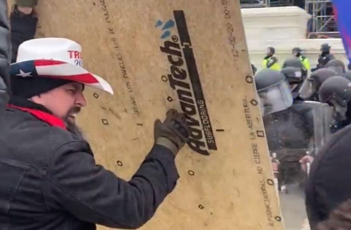 Feds nab MAGA rioter dressed in Proud Boy apparel who assaulted cops with 'a large piece of plywood'