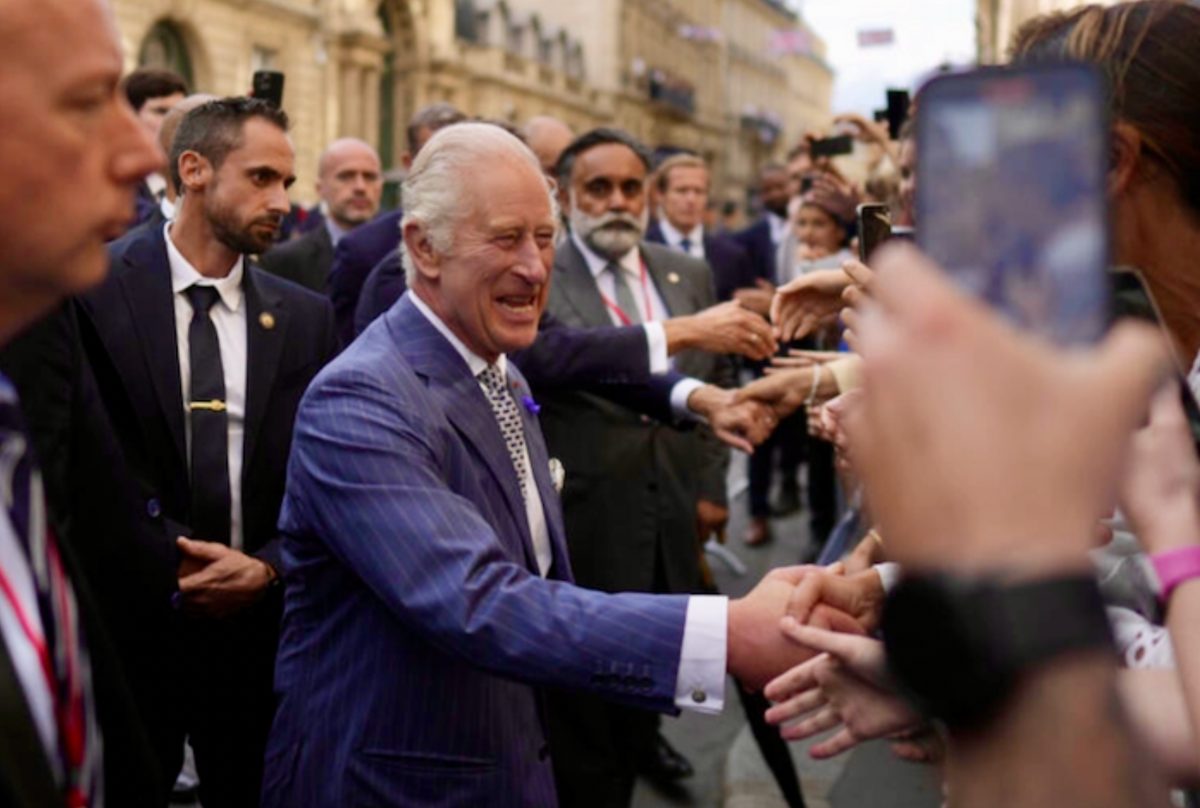 'Big shoes to fill': Paris crowd greets Charles III
