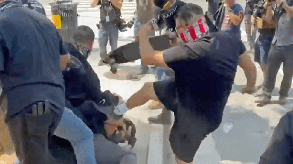 Harrowing videos capture Proud Boys' violence at anti-vaxx rally in downtown Los Angeles: reports
