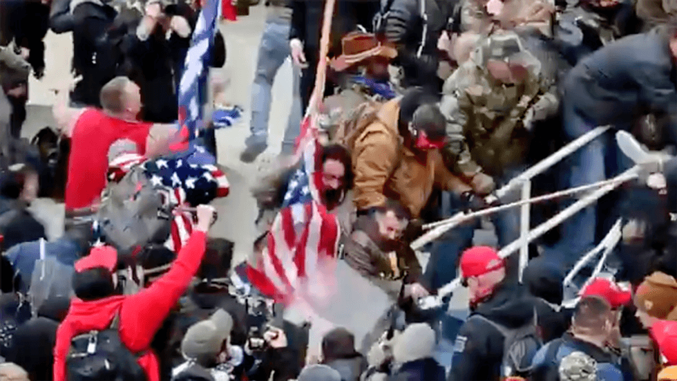 Arrested Capitol rioter claims he thought officer he beat with US flagpole was 'antifa': report