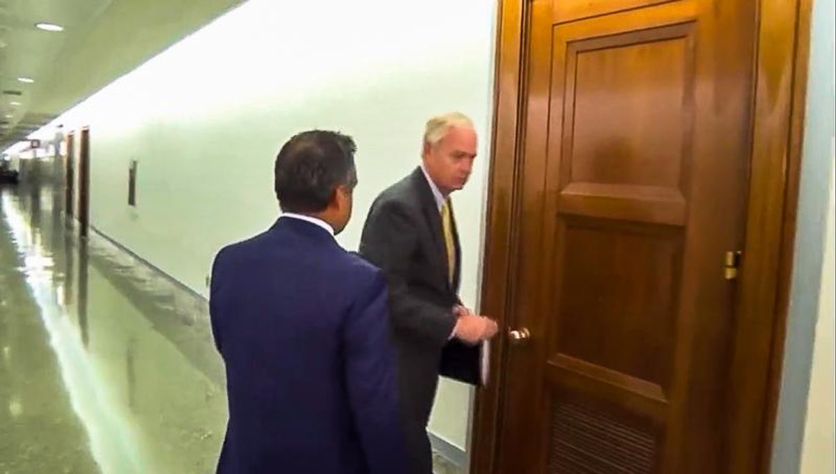 Watch: Ron Johnson attempts to flee through locked door as he avoids question on school shooting