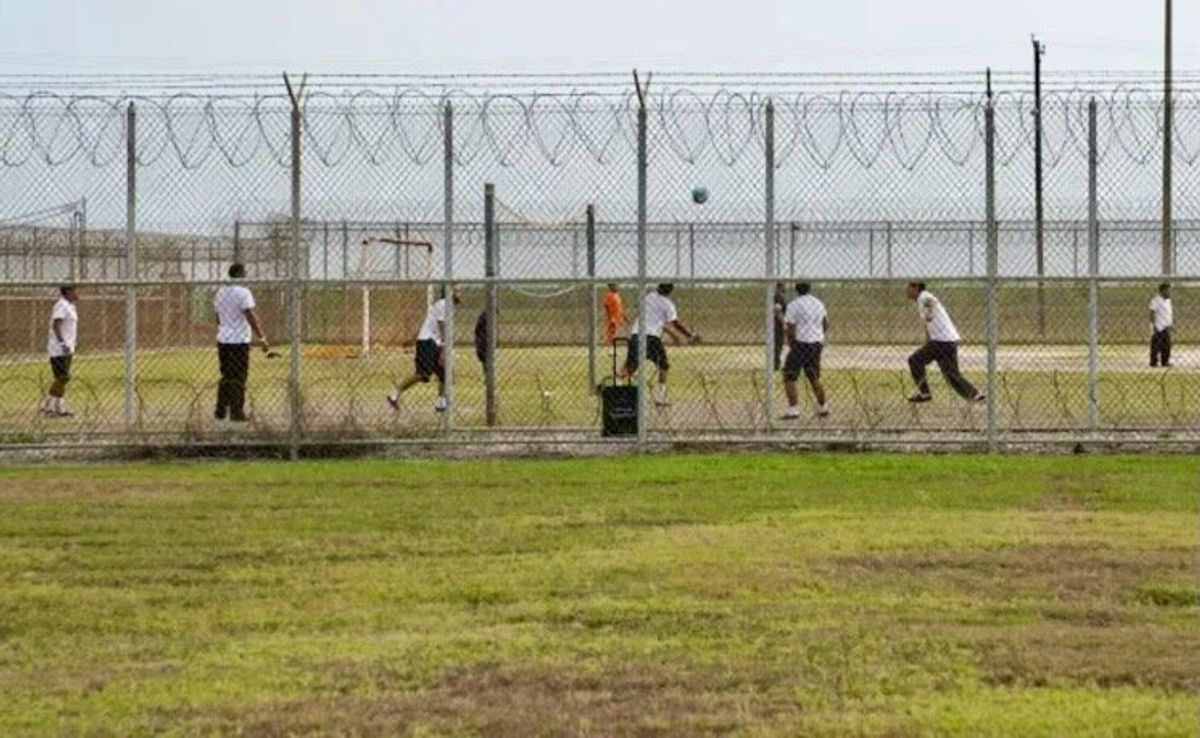 Color-coded migrants wait for answers in Texas heat