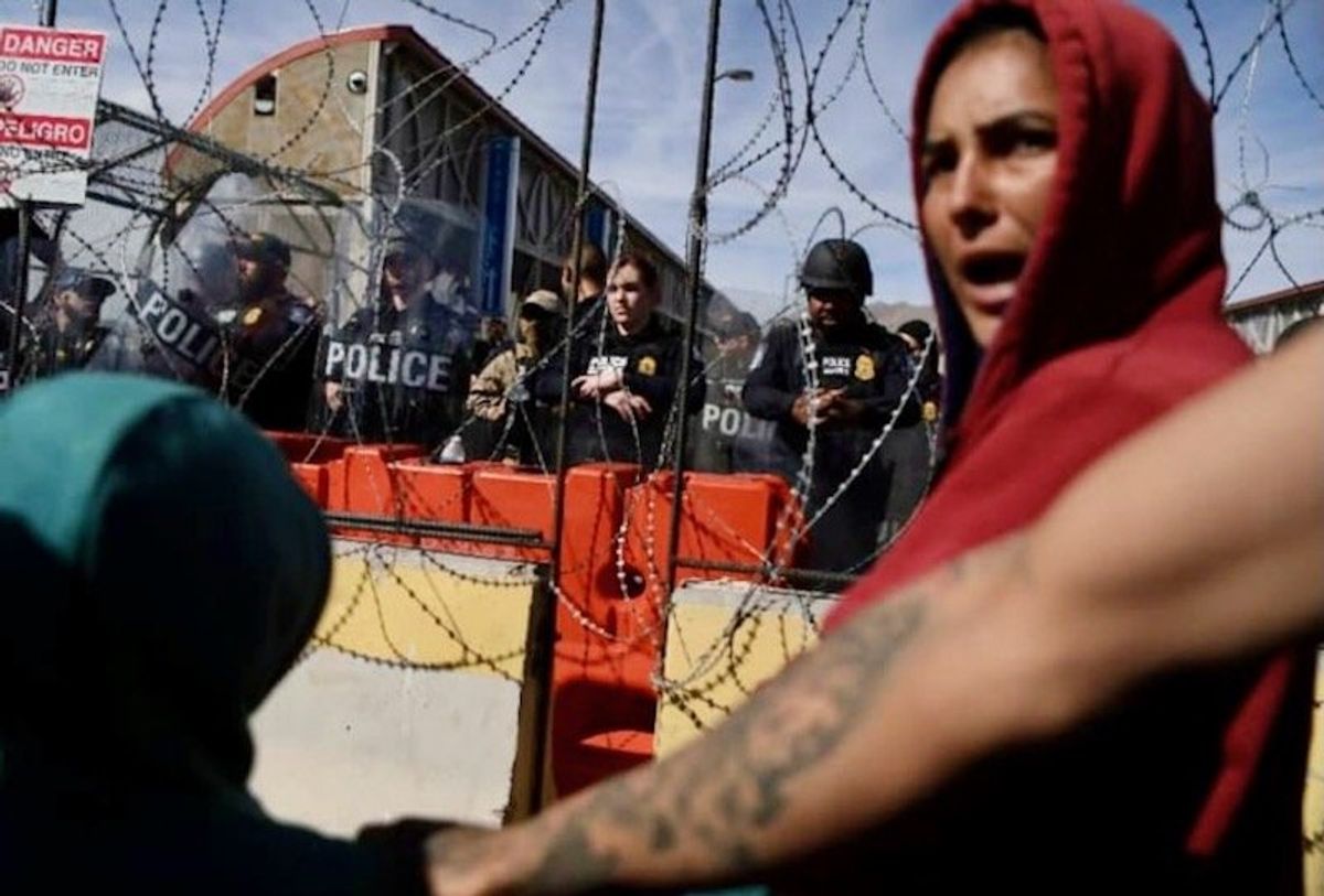 Hundreds of migrants attempt to storm the US-Mexico border