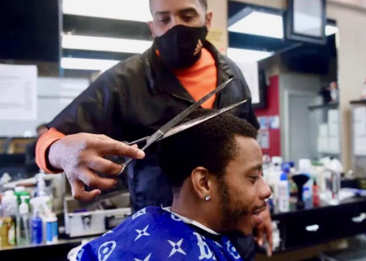 African-American barber snips COVID fictions