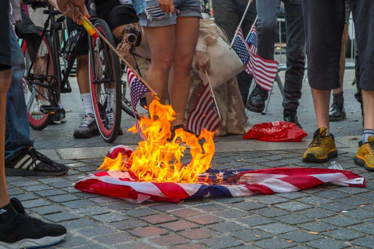 Trump DOJ quietly quits case against flag-burning protester at White House