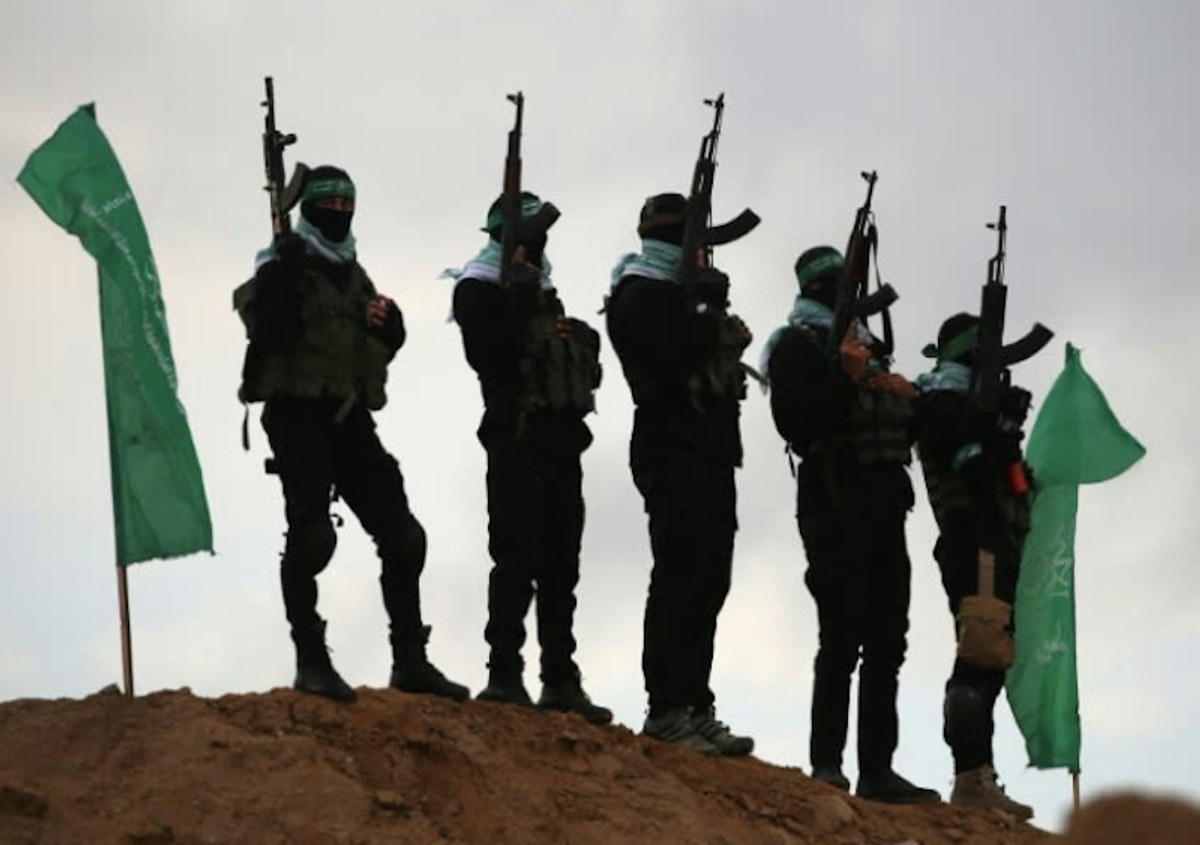 Hamas hands over dead Israeli hostages in black coffins